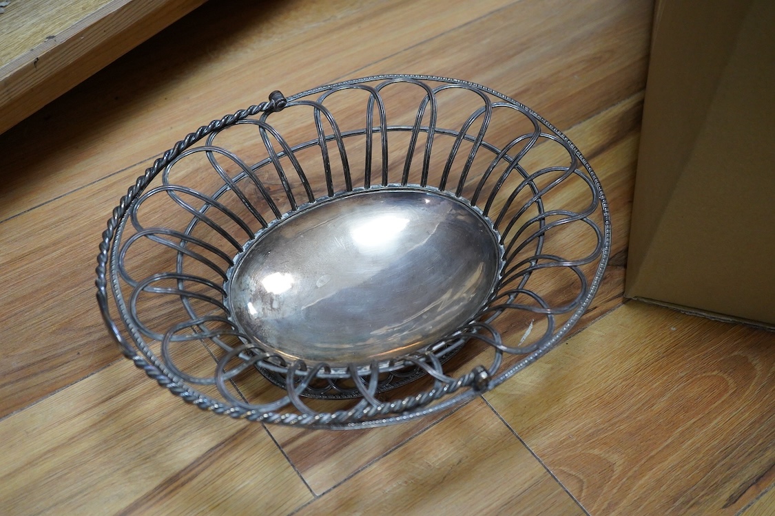 An Old Sheffield plated basket, a plated muffin dish and cover by Elkington & Co and a quantity of assorted plated wares including entrée dishes, flatware, salvers, etc.